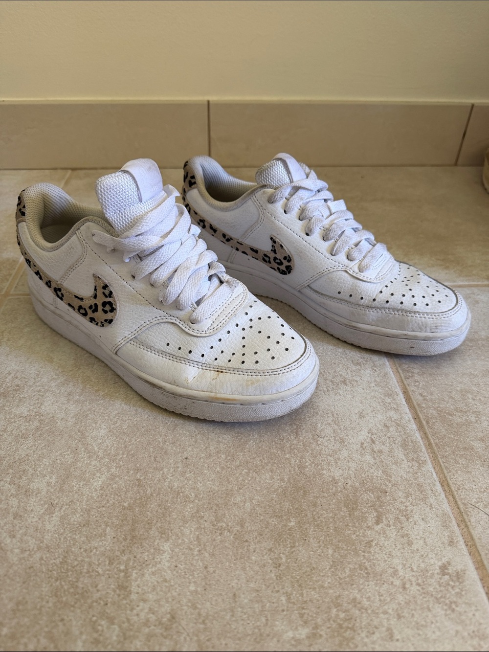 Nike Women's White Sneakers with Leopard Swoosh Accents